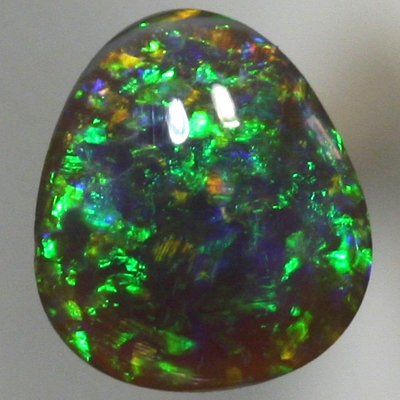 SOLID BLACK OPAL Pretty! Sparkling and bright gemmy green fire. SEE VIDEO
